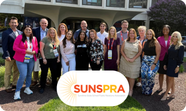 Members of SUNSPRA stand outside the hotel hosting the 2025 NSPRA National Seminar